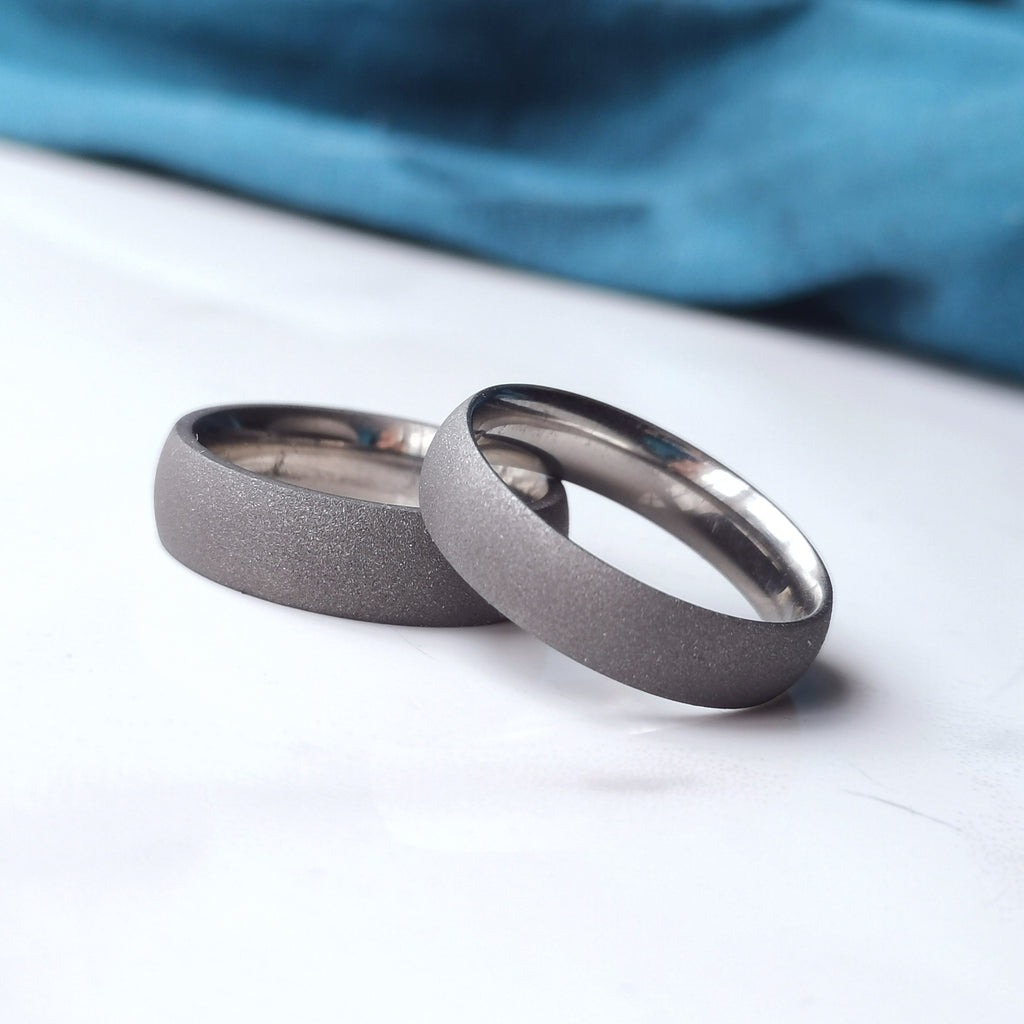 textured sandblasted titanium wedding bands couple