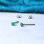 A Pair of Emerald Titanium Earrings