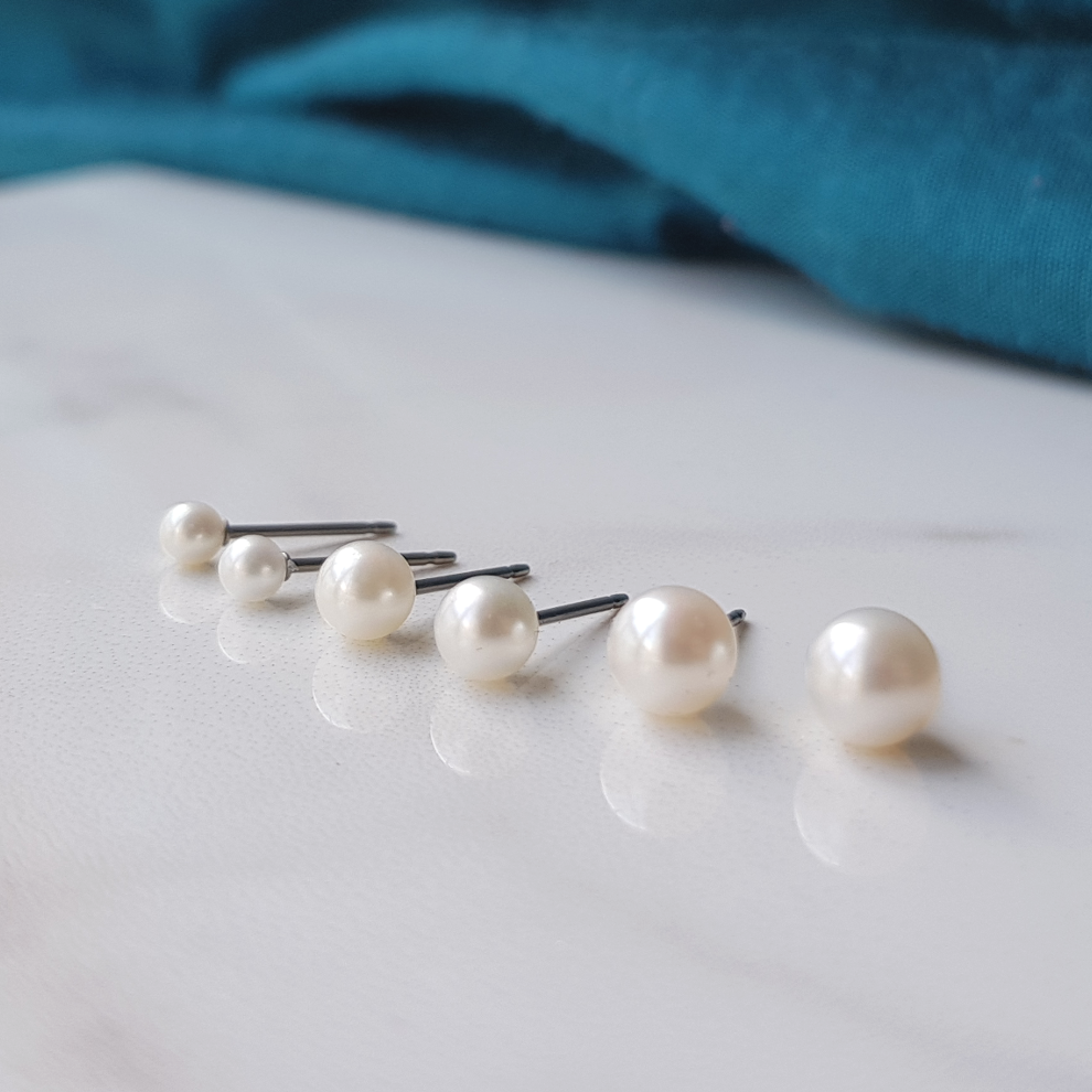 Pearl titanium earrings. allergy free pearl titanium stud earrings