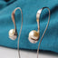 Modern deign Titanium earrings, southsea pearls