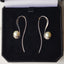 Titanium pearl earrings in a case